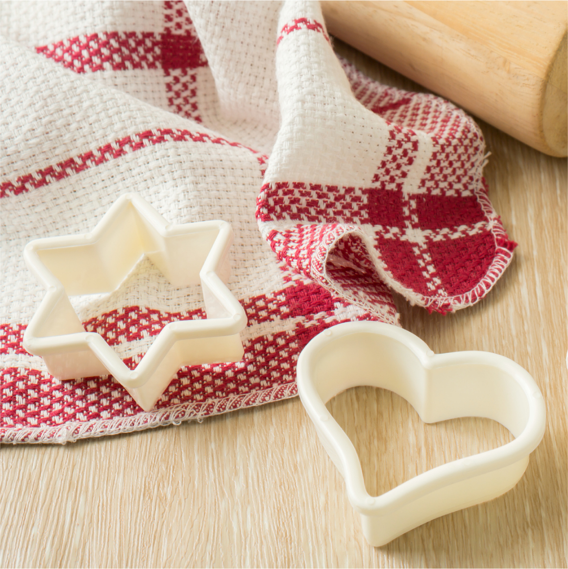 Cookie cutters on table with table cloth