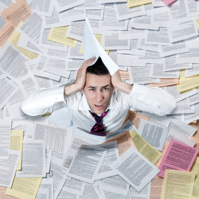 Person in a pile of papers