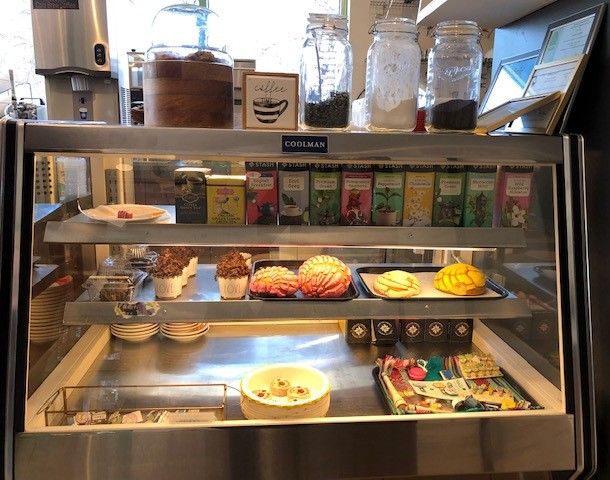 Glass case with cakes and other baked goods
