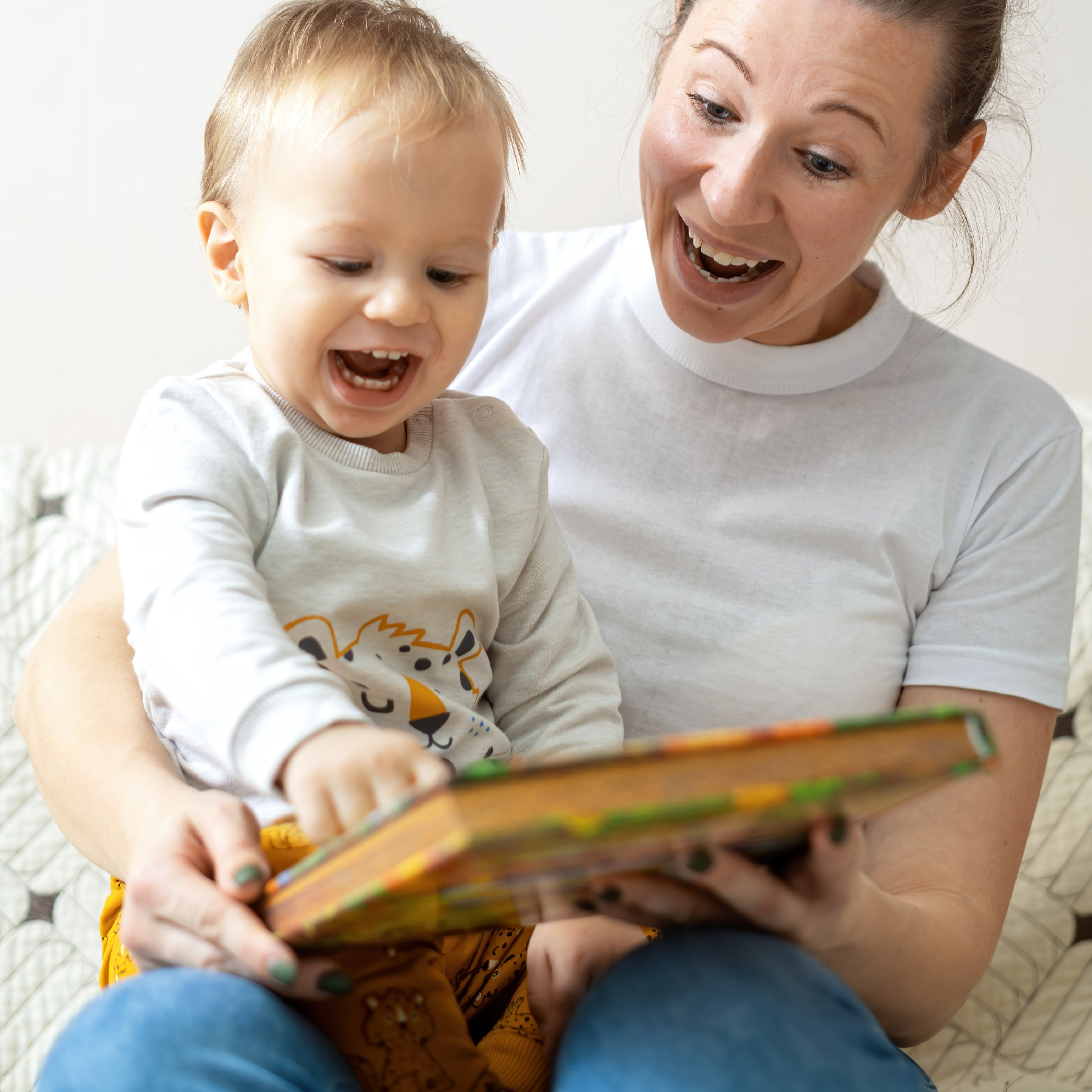 Person with baby reading book