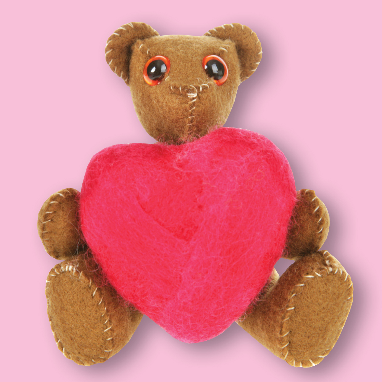 Teddy bear holding a heart