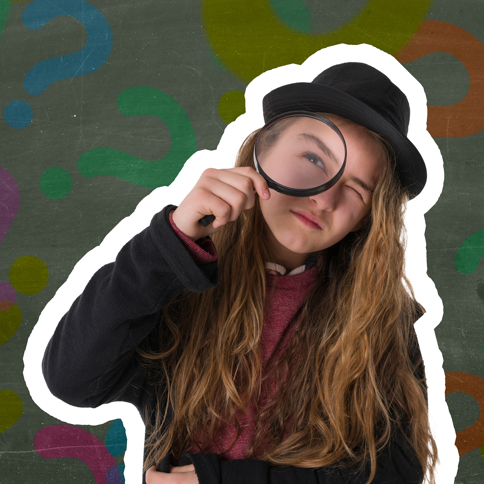 Girl wearing a hat looking through a magnifying glass