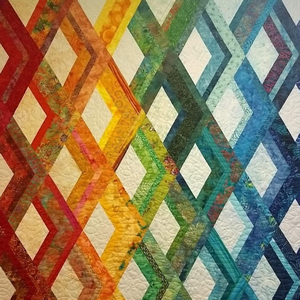 Quilt with colorful crossed lines