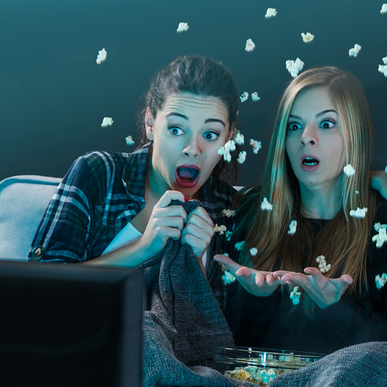Teenagers scared while watching movie