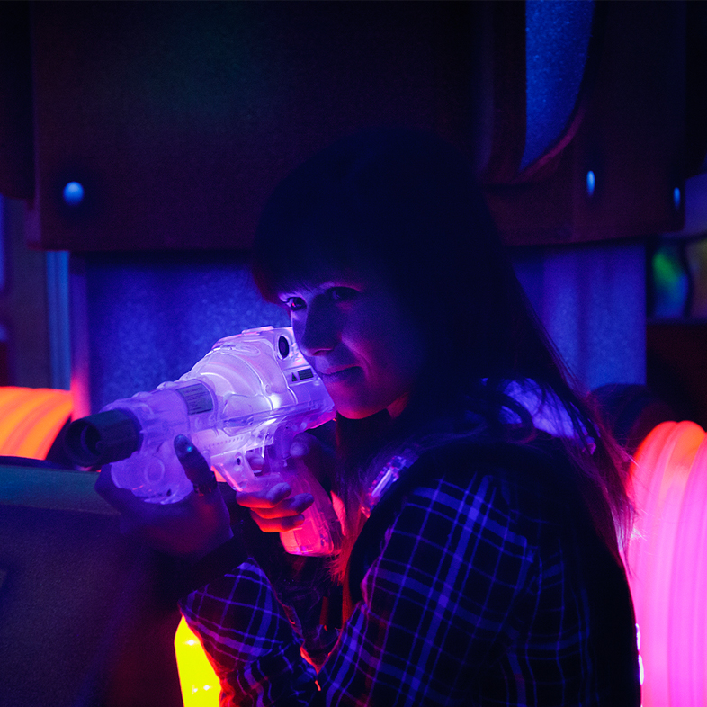 Woman playing laser tag