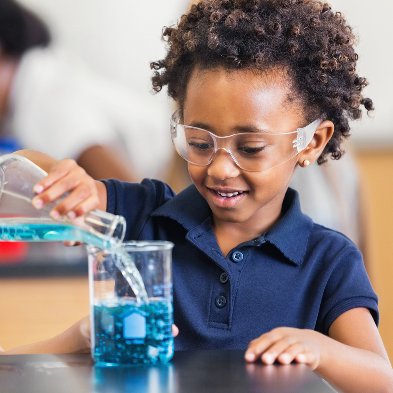Young girl working on science experiment