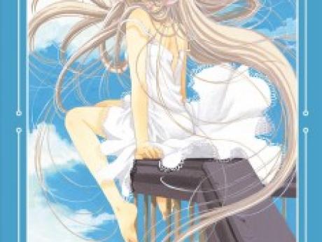 A girl in a white dress with long hair and metal ears gazes into the distance.
