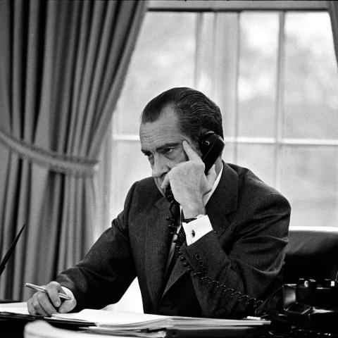 Nixon at desk on the phone
