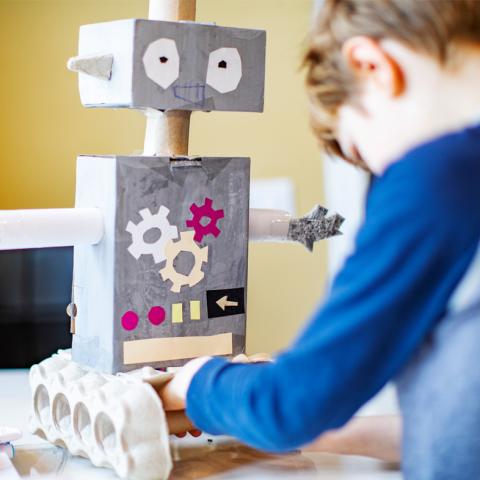 Boy building robot