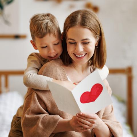 Mother and son reading Mother's Day card