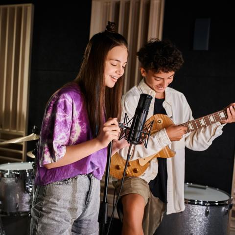 Teens performing at an open mic