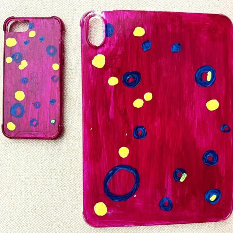 Plastic cellphone and tablet covers painted in bright colors
