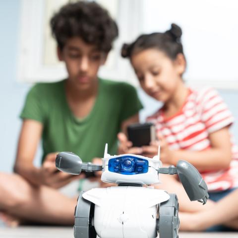 Kids playing with robot