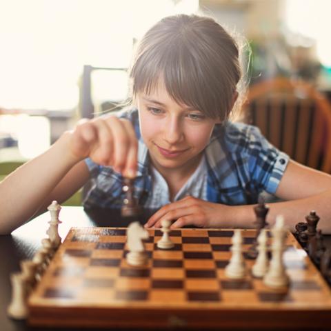 Child playing chess