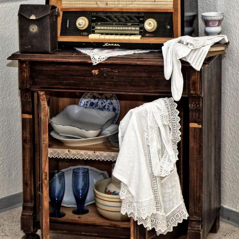 Antique objects on and in an old cabinet