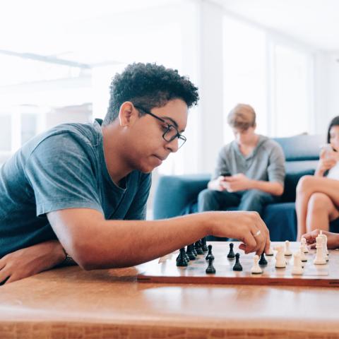 Teen playing chess