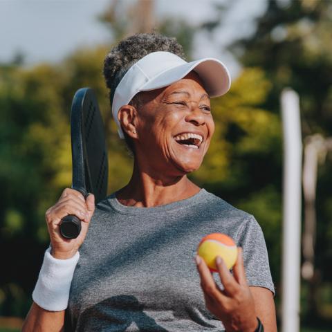 Senior playing tennis