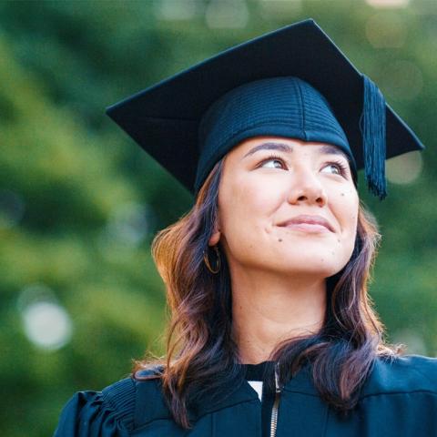 Student wearing graduation cap and gown