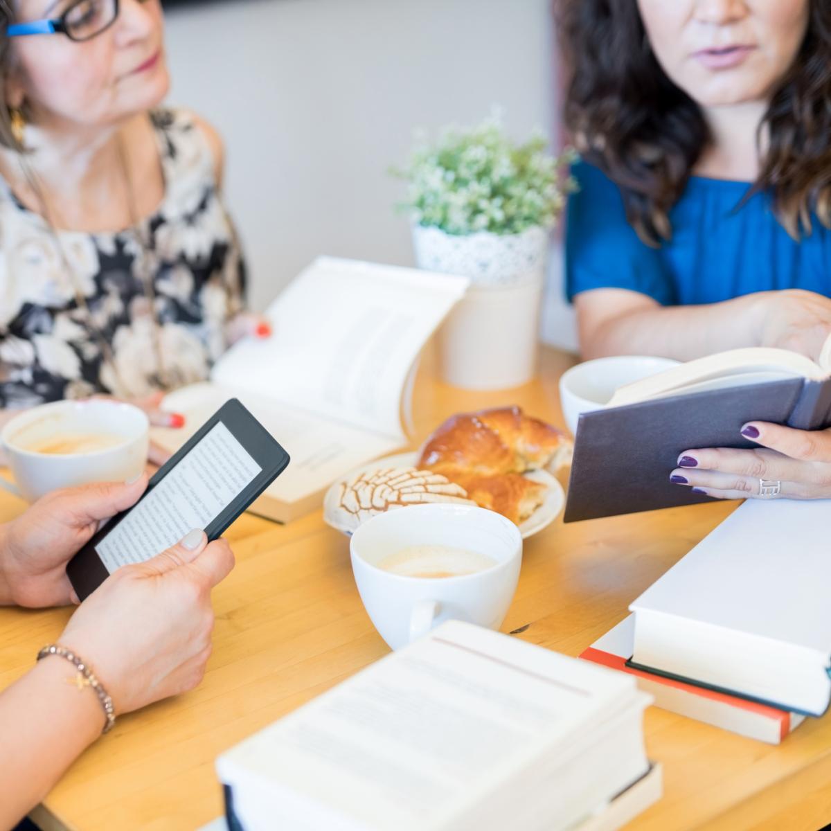 People reading at a table