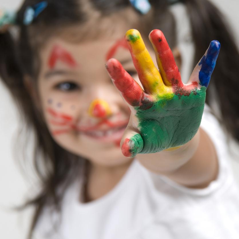 Child with painted hand