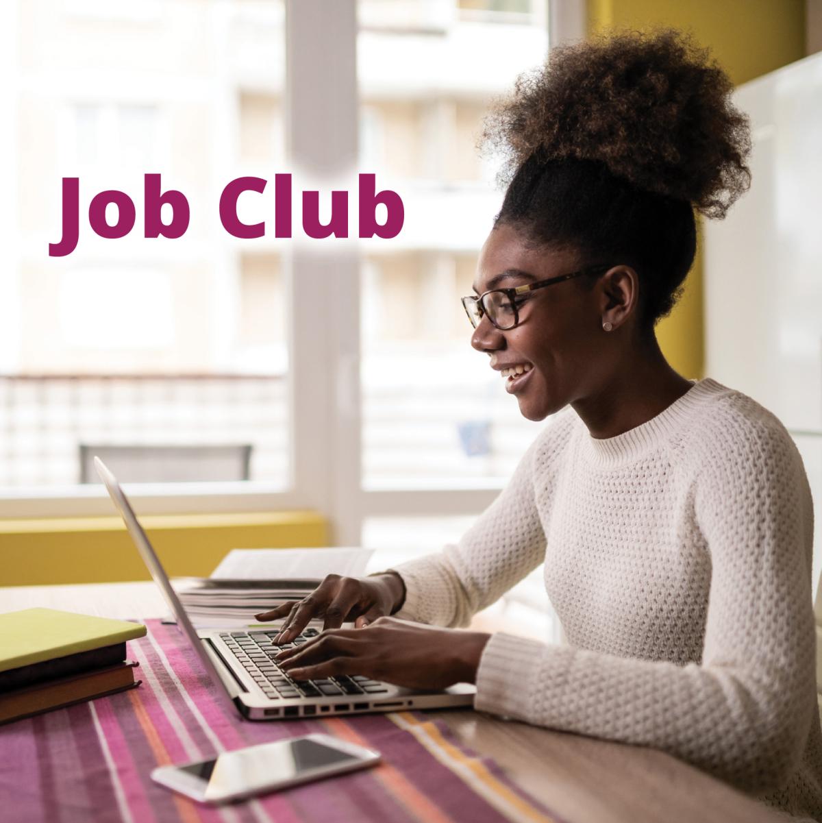 Person sitting at table on computer with "Job Club" text on image