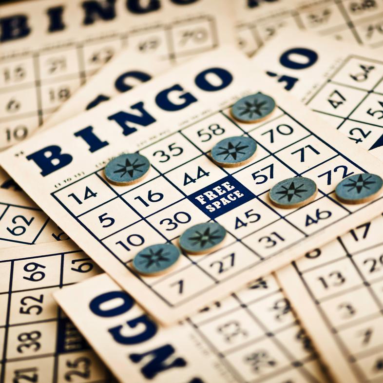 stack of bingo boards and markers