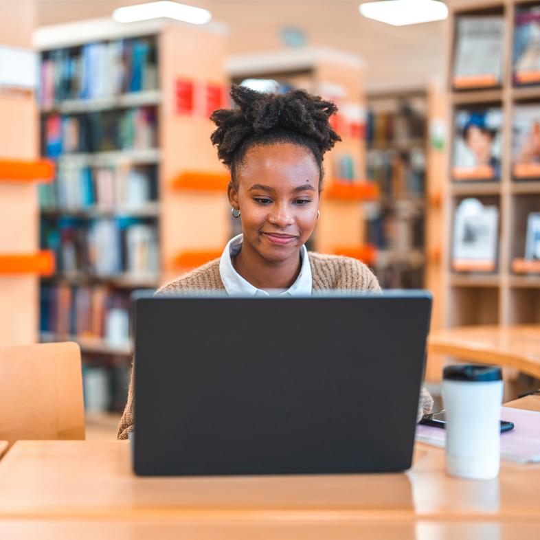 Woman on laptop in the library