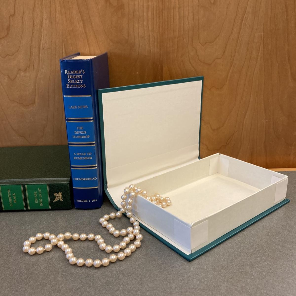 Hardcover book made into hidden storage box