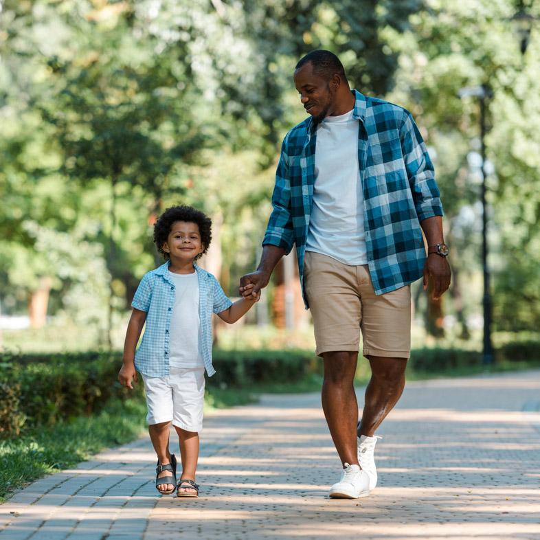 Father and son walking in the park