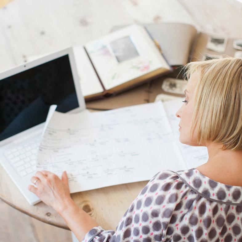 Woman looking at family tree