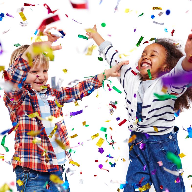 Children dancing in confetti