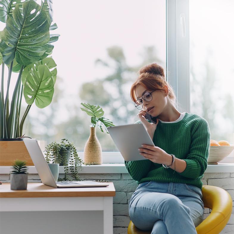 Woman reviewing documents at desk